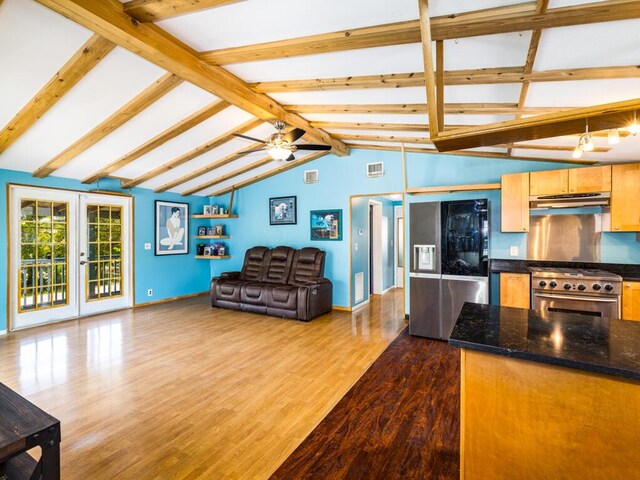 kitchen featuring lofted ceiling with beams, stainless steel appliances, french doors, and light wood-type flooring