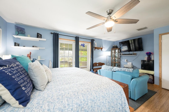 bedroom with hardwood / wood-style flooring and ceiling fan