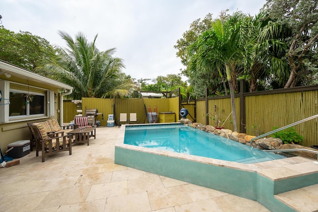 view of swimming pool with a patio