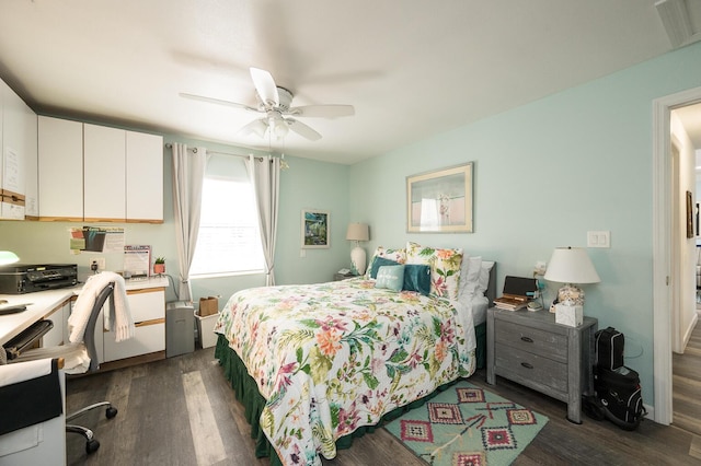 bedroom with dark wood-type flooring and ceiling fan