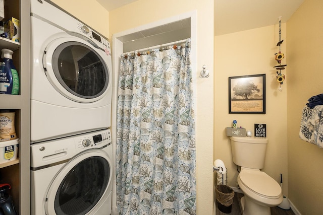 laundry area with stacked washing maching and dryer