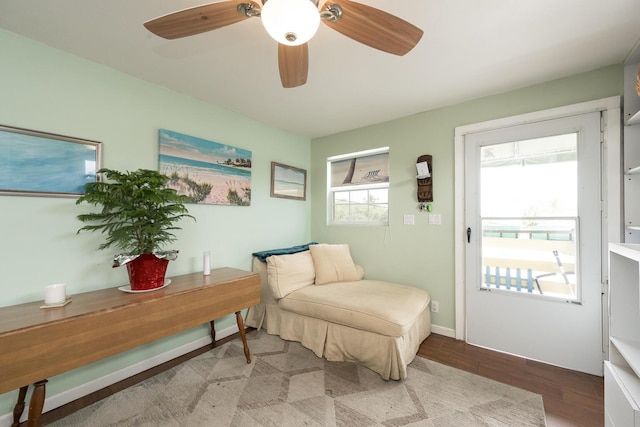 sitting room featuring hardwood / wood-style flooring and ceiling fan