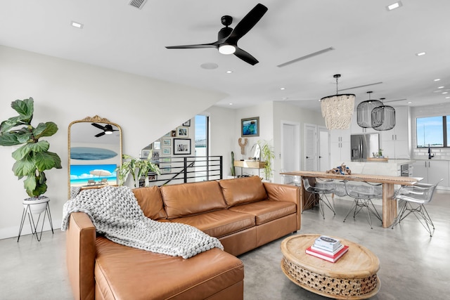 living room featuring sink and ceiling fan