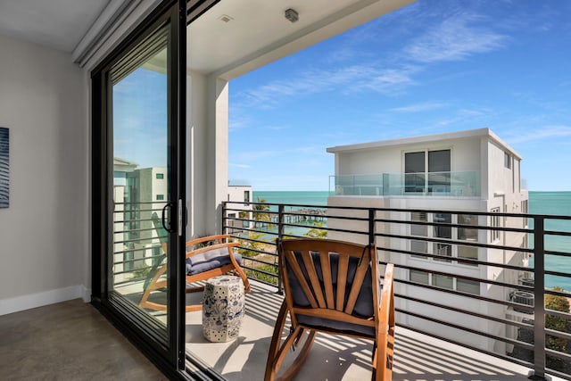 balcony featuring a water view