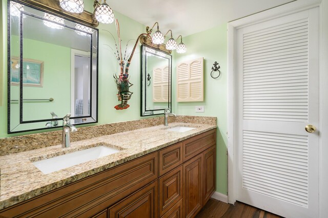 bathroom featuring vanity and wood-type flooring