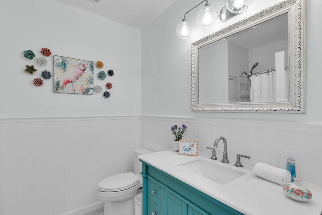 661 12th St, Key Colony, FL 33051 - full bathroom featuring a wainscoted wall, vanity, and curtained shower