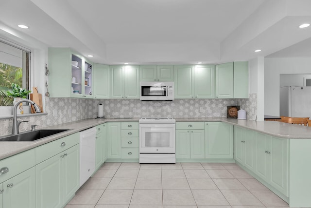 661 12th St, Key Colony, FL 33051 - kitchen with white appliances, green cabinets, a peninsula, light countertops, and recessed lighting