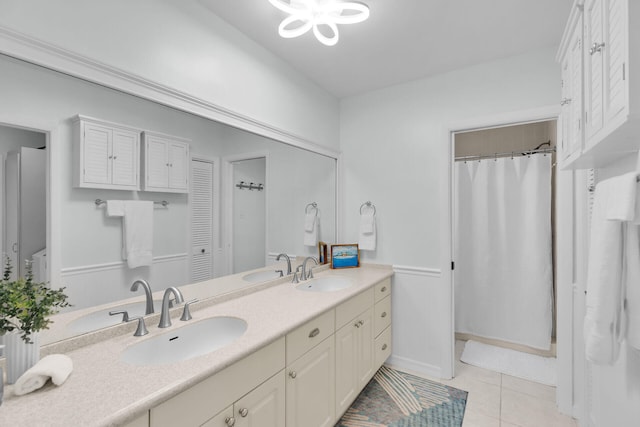 661 12th St, Key Colony, FL 33051 - bathroom featuring double vanity, tile patterned flooring, and curtained shower