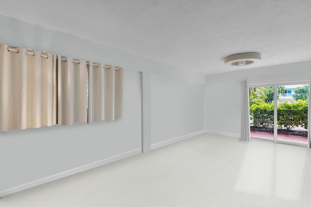 661 12th St, Key Colony, FL 33051 - empty room with baseboards and carpet