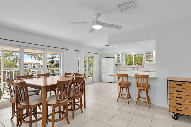 661 12th St, Key Colony, FL 33051 - dining area featuring a ceiling fan, light tile patterned flooring, and recessed lighting