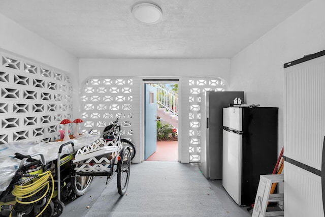 661 12th St, Key Colony, FL 33051 - garage featuring freestanding refrigerator