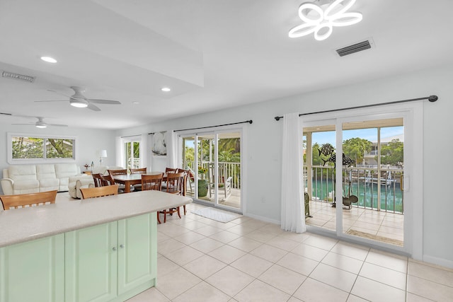 661 12th St, Key Colony, FL 33051 - kitchen with plenty of natural light, recessed lighting, light countertops, a water view, and light tile patterned flooring