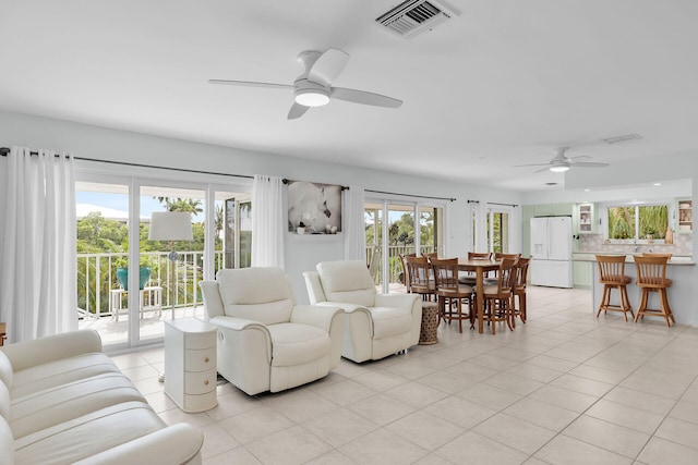 661 12th St, Key Colony, FL 33051 - living room featuring a ceiling fan and light tile patterned flooring