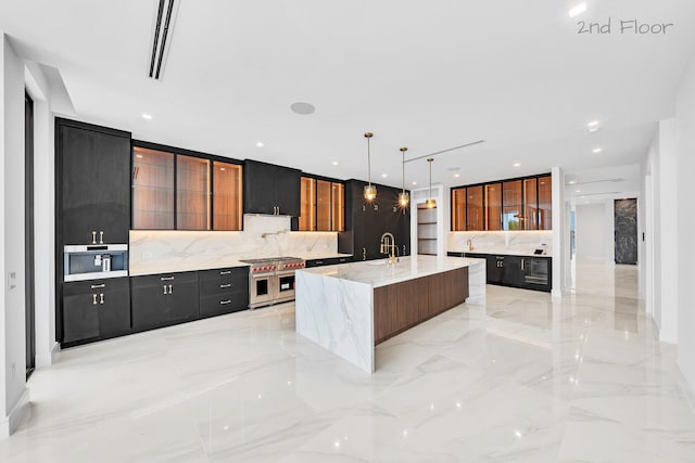 16 Seaside Ave, Key Largo, FL 33037 - kitchen featuring modern cabinets, tasteful backsplash, a large island with sink, double oven range, and pendant lighting