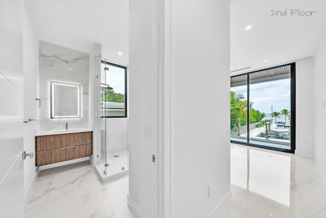 16 Seaside Ave, Key Largo, FL 33037 - full bathroom featuring plenty of natural light, vanity, marble tiled floors, a marble finish shower, and recessed lighting