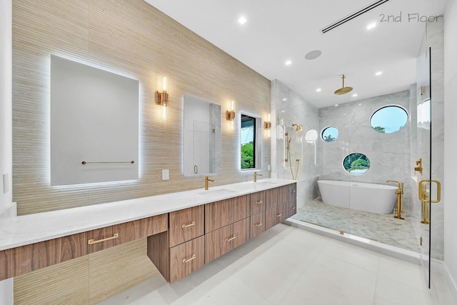 16 Seaside Ave, Key Largo, FL 33037 - bathroom featuring a freestanding bath, double vanity, a shower stall, recessed lighting, and tile patterned floors