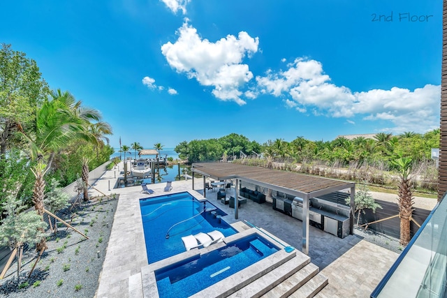 16 Seaside Ave, Key Largo, FL 33037 - swimming pool featuring boat lift, a patio area, and a boat dock