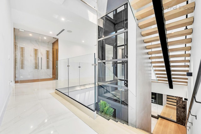 16 Seaside Ave, Key Largo, FL 33037 - hall with recessed lighting, baseboards, and a towering ceiling