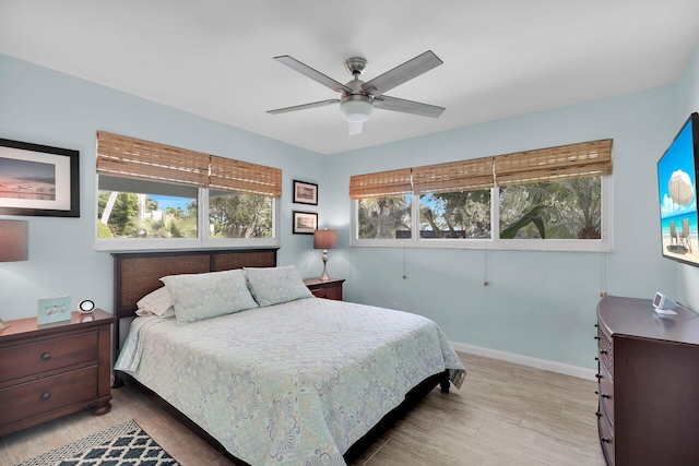 bedroom featuring light wood-type flooring and ceiling fan