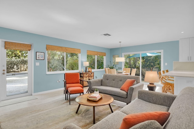 living room with light hardwood / wood-style flooring