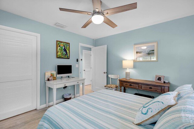 bedroom featuring ceiling fan and light wood-type flooring