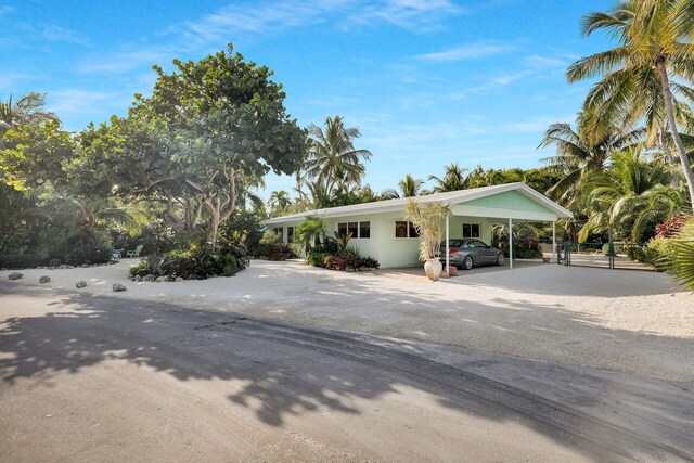 view of front of property with a carport