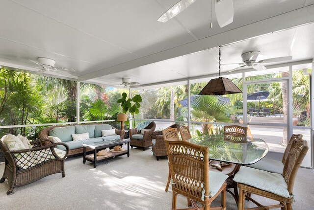 sunroom / solarium featuring a wealth of natural light and ceiling fan