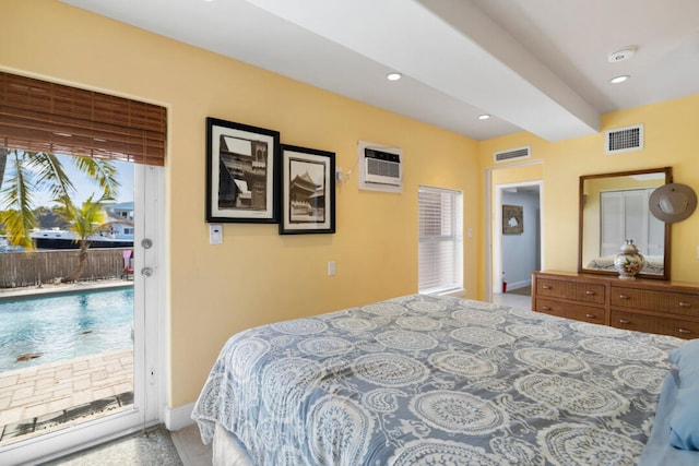 bedroom featuring a wall mounted air conditioner and access to outside