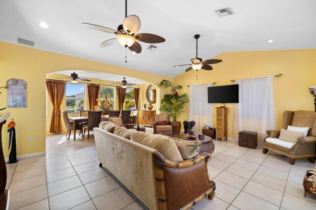 tiled living room with lofted ceiling