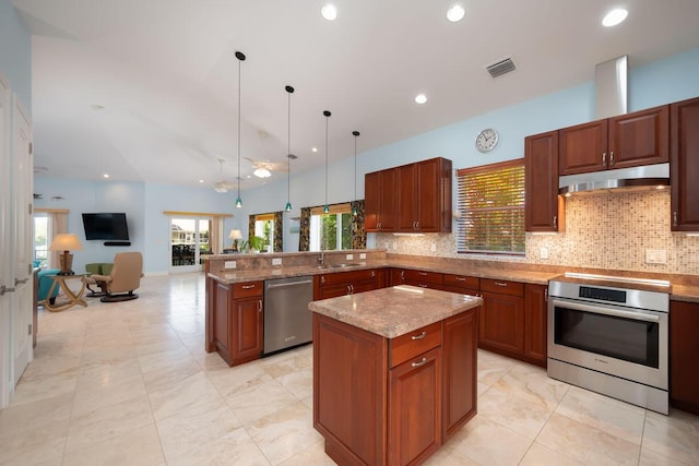 kitchen featuring stainless steel appliances, tasteful backsplash, hanging light fixtures, and kitchen peninsula