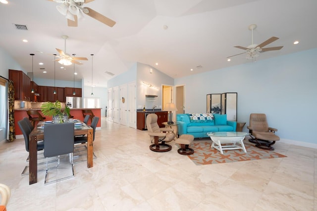 living room featuring high vaulted ceiling and ceiling fan