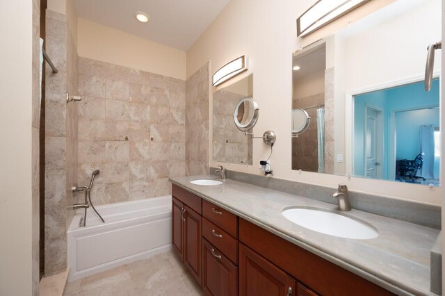 bathroom featuring tile patterned floors, vanity, and a bathtub