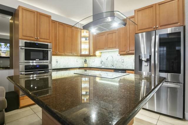 28 Seaside S Ct, Key West, FL 33040 - kitchen featuring a spacious island, stainless steel fridge with ice dispenser, dark stone countertops, island exhaust hood, and decorative backsplash