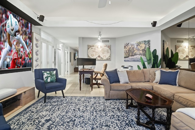 living room with light tile patterned floors and ceiling fan