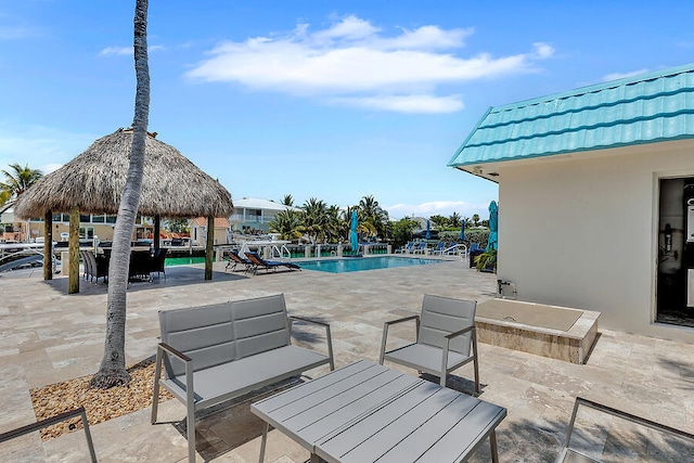 view of patio featuring a gazebo and an outdoor hangout area