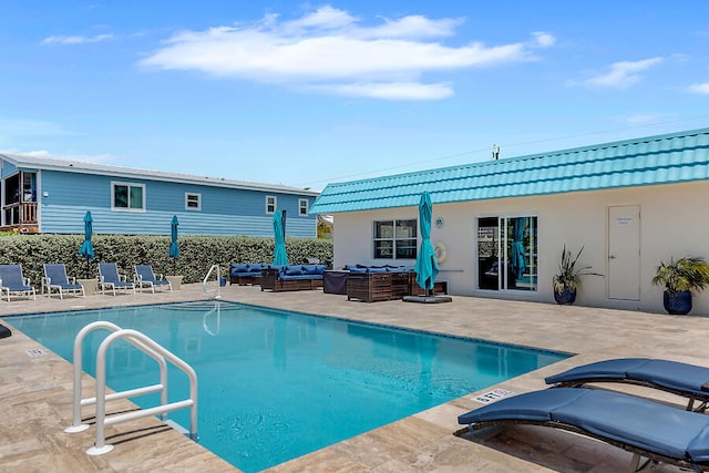 view of pool with a patio and outdoor lounge area