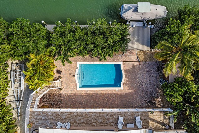 view of pool with a water view