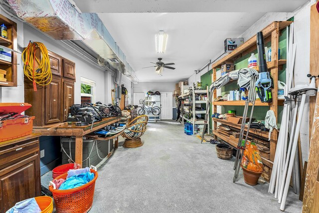 misc room featuring concrete floors and ceiling fan