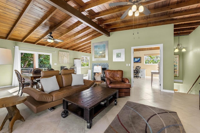 tiled living room with beamed ceiling, wood ceiling, a healthy amount of sunlight, and ceiling fan