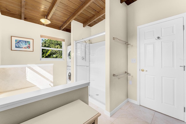 bathroom featuring stacked washing maching and dryer, vaulted ceiling with beams, wooden ceiling, tile patterned floors, and walk in shower