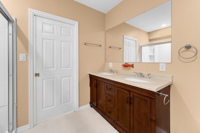 bathroom featuring vanity and a shower with door