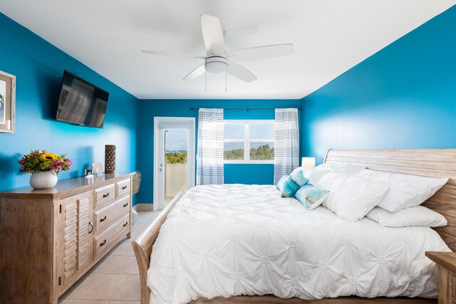 tiled bedroom featuring access to outside and ceiling fan