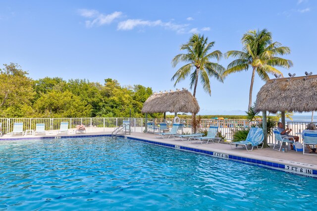 view of swimming pool with a gazebo and a patio area