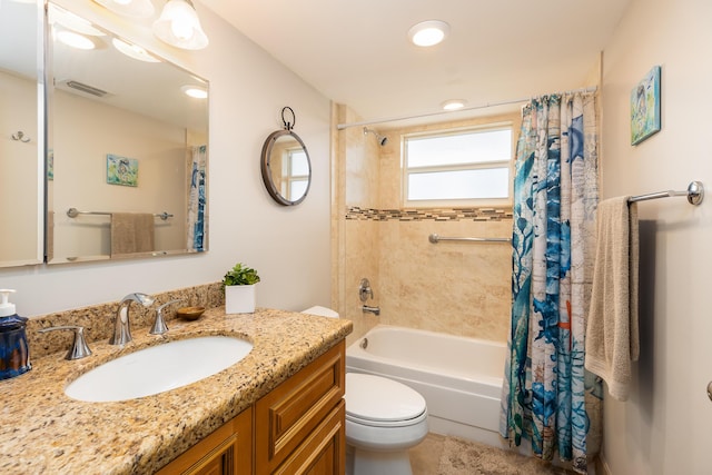 full bathroom with vanity, shower / bath combination with curtain, and toilet