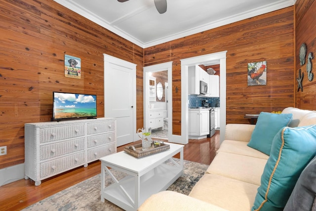 1203 Newton St Unit 2, Key West, FL 33040 - living room with wood walls, a ceiling fan, ornamental molding, and wood finished floors