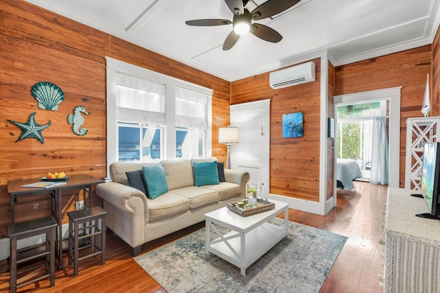 1203 Newton St Unit 2, Key West, FL 33040 - living area featuring a wall unit AC, wood walls, a ceiling fan, hardwood / wood-style floors, and ornamental molding