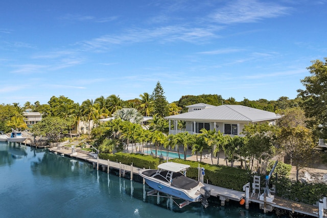 view of dock with a water view, an outdoor pool, and boat lift