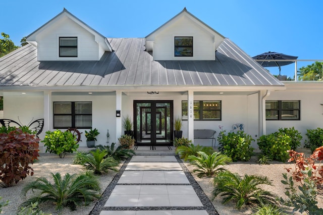 1610 Von Phister St, Key West, FL 33040 - view of front of home with a standing seam roof, a porch, french doors, stucco siding, and metal roof