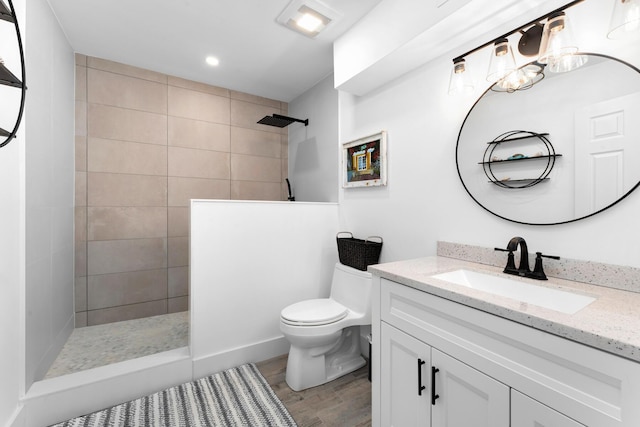 1610 Von Phister St, Key West, FL 33040 - bathroom with vanity, a walk in shower, toilet, wood finished floors, and recessed lighting
