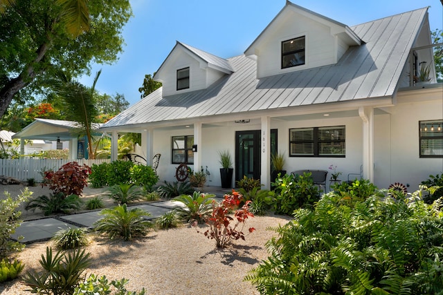 1610 Von Phister St, Key West, FL 33040 - view of front of home with covered porch, metal roof, a standing seam roof, and stucco siding